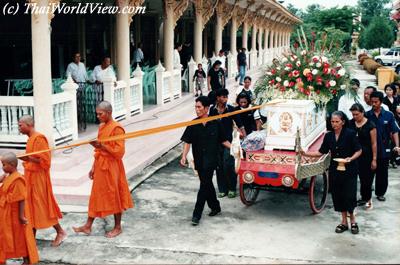 Carrying coffin to the Buddhist temple
