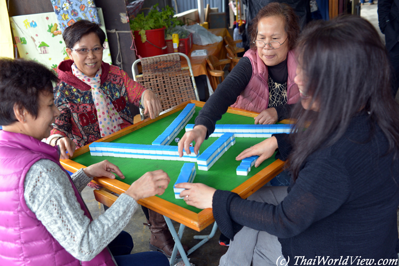 Playing Mahjong - Sam Mun Tsai