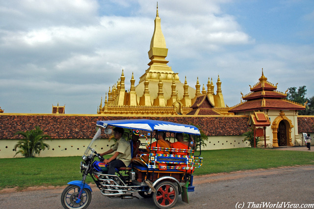 Monks in "tuk-tuk" - Pha That Luang
