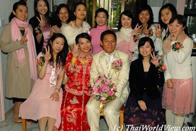 Bride and groom with unmarried girls